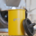 Airscape Kaffeedose in Gelb mit Nero-Branding, aromadicht